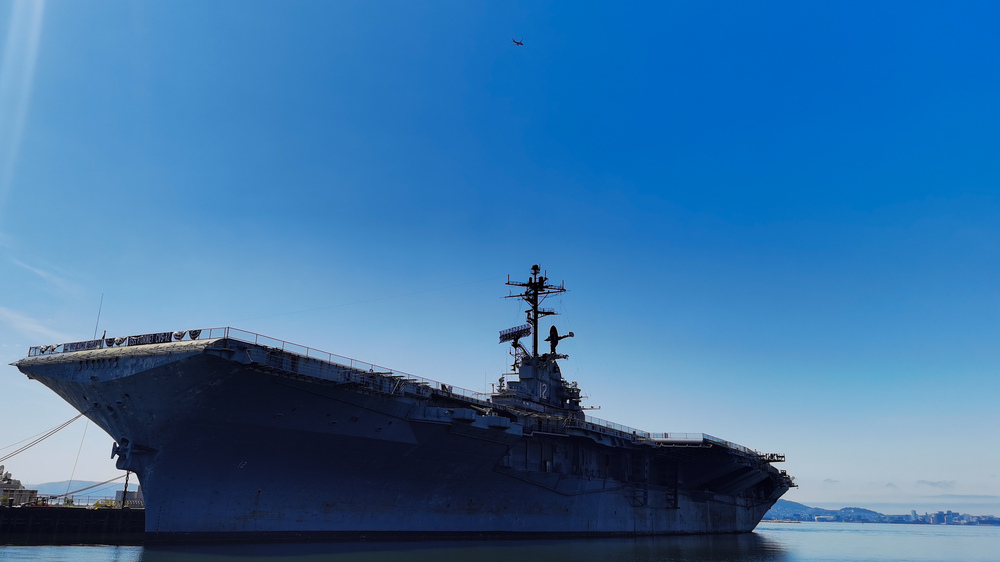 USS Hornet and an airliner